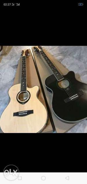 Two Black And Natural Finish Single Guitar 