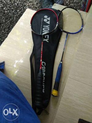 Two Blue And Red Yonex Badminton Rackets With Bag