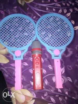 Two Pink-and-blue Racket Toys