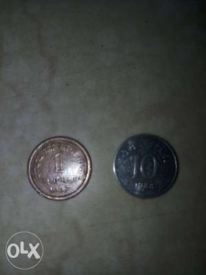 Two Round Silver-colored 1 And 10 Indian Coins