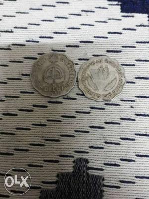 Two Scalloped Round Silver-colored Delhi Coins