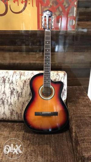 Want to sell my Pluto acoustic guitar. Good for beginners