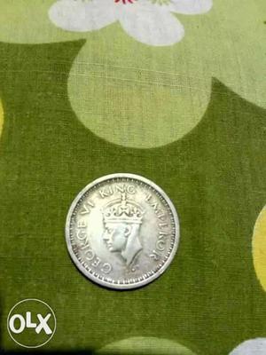 ...round silver coin...it's urgent sell
