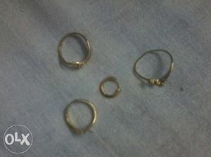 3 gold rings (1-men, 2- women) 1 boys ear ring