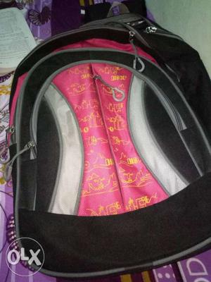 Black, Pink, White, And Yellow Backpack
