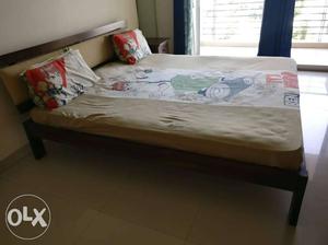 King size solid wood bed from Urban ladder. only