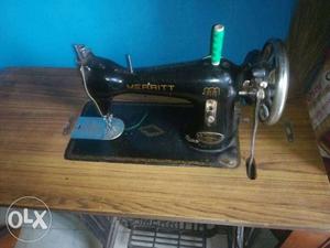 Merrit sewing machine in a very oiled up