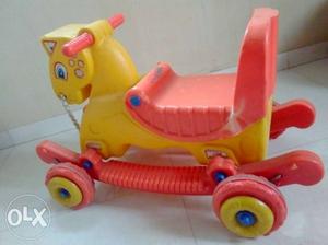 Yellow And Pink Plastic Rocking Horse Ride-on Toy
