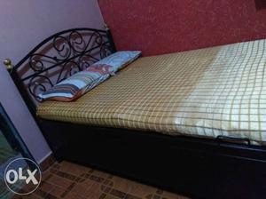 Double storage bed with mattress and two pillows