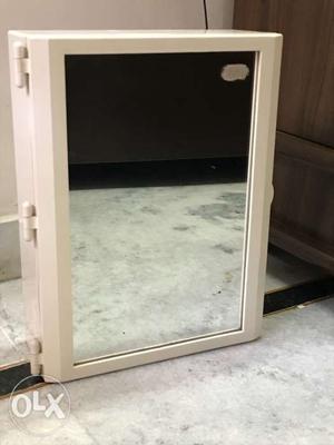Rectangular White Framed Mirror and cabinet