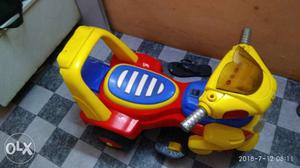 Red, Yellow, And Blue Ride-on Toy Motorcycle