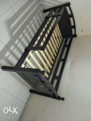 Single cot for kids, made of solid wood.