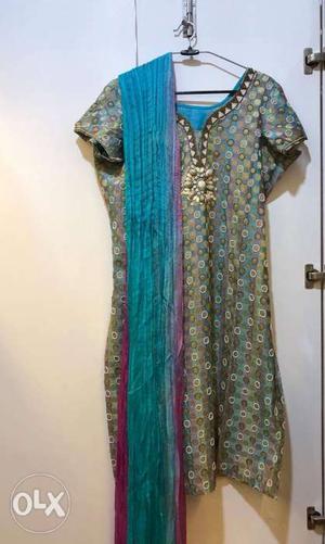 A colourful Punjabi suit with a crushed dupatta.
