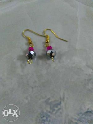 A crystal earring in pink and silver