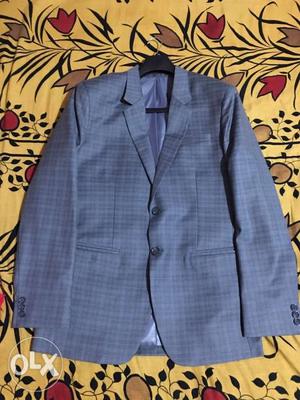 Brand new Raymond suit. Used only once and price