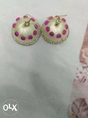 Pair Of Beige Silk Thread Earrings With Pink Gemstones