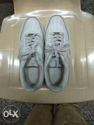 Pair Of Gray Nike Low-top Sneakers
