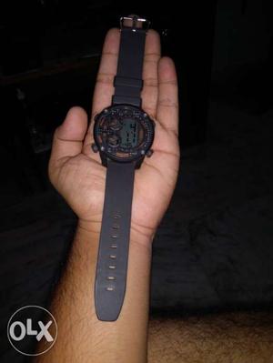 This is fastrack watch with digital time and day