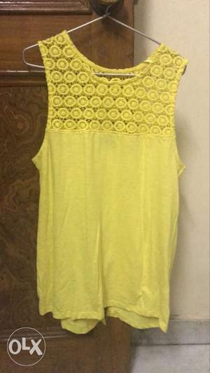 Yellow colour cotton top with net on shoulders...