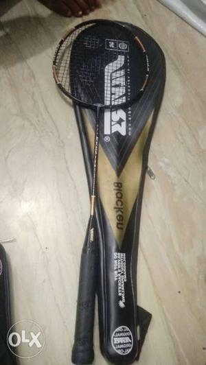 Black Badminton Racket With Beige And Black Leather Case