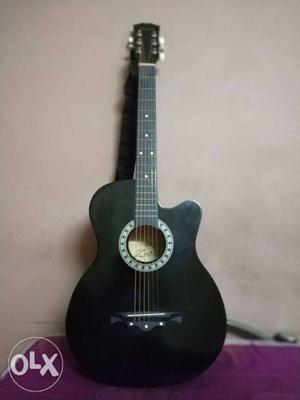 Black acoustic guitar just 3 months used, selling for only