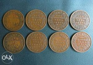 Eight Round Gold-colored 1 Quarter Anna Indian Coins