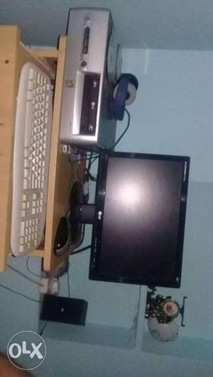 Flat Screen Monitor And White Keyboard