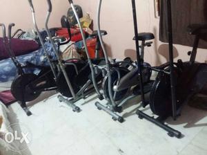 Four Black And Gray Elliptical Trainers