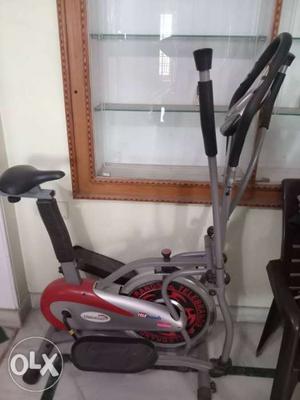 Red, Black, And Gray Elliptical Trainer