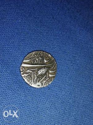 Round Silver-colored Coin