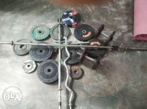 Three Gray Barbell Rods And Weight Plate Lot