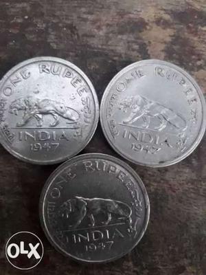 Three  Silver-colored 1 India Rupee Coins