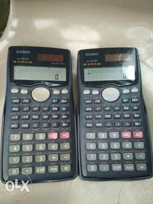 Two Black And Gray Texas Instruments TI-84 Plus