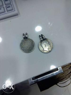 Two Round Silver-colored Coin Pendants