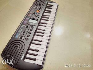 White And Black Electronic Keyboard