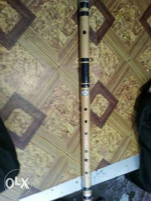 White And Black Wooden Flute