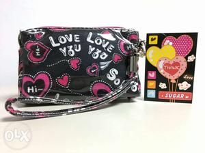 Black, White, And Pink Love You Printed Leather Wristlet