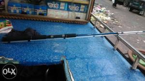 Blue, White, And Black Fishing Rod