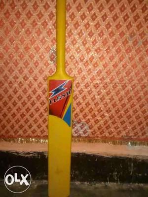 It is a yellow colour plastic bat having very