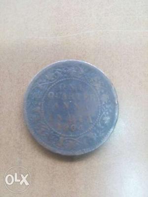 Round Silver-colored One Quarter Indian Anna Coin