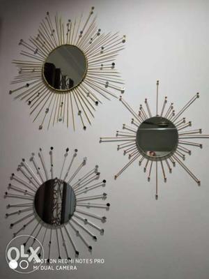 Three Round Mirrors With Gray Sunburst Frames