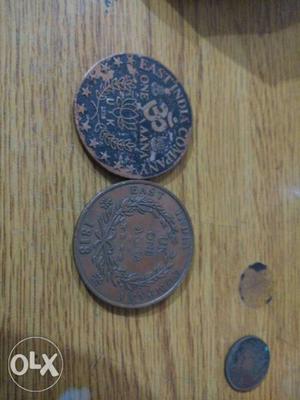 Two Round Blue And Gray Coins