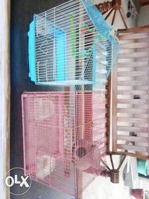 Blue and pink bird cage..with two breeding pots