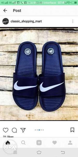 Pair Of Blue Nike Slide Sandals