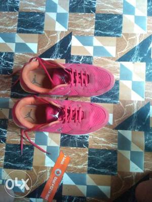 Pair Of Pink Nike Low-top Sneakers