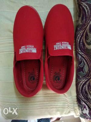 Pair Of Red Vans Slip-on Shoes
