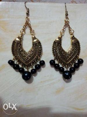 Pair Of Women's golden-colored Dangle Earrings With Black