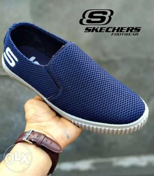 Paired Blue And White Skechers Slip-on Shoe