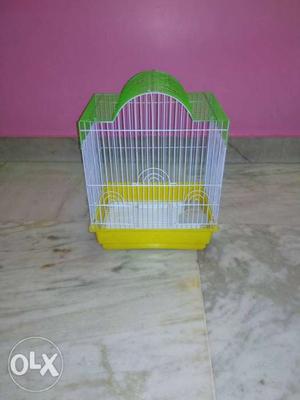 White, Green, And Yellow Pet Cage