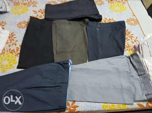 6 branded trousers. 34 waist